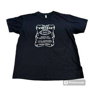 Black short sleeved T shirt, "Premium Vintage Made in 1967" spell out, XL.
